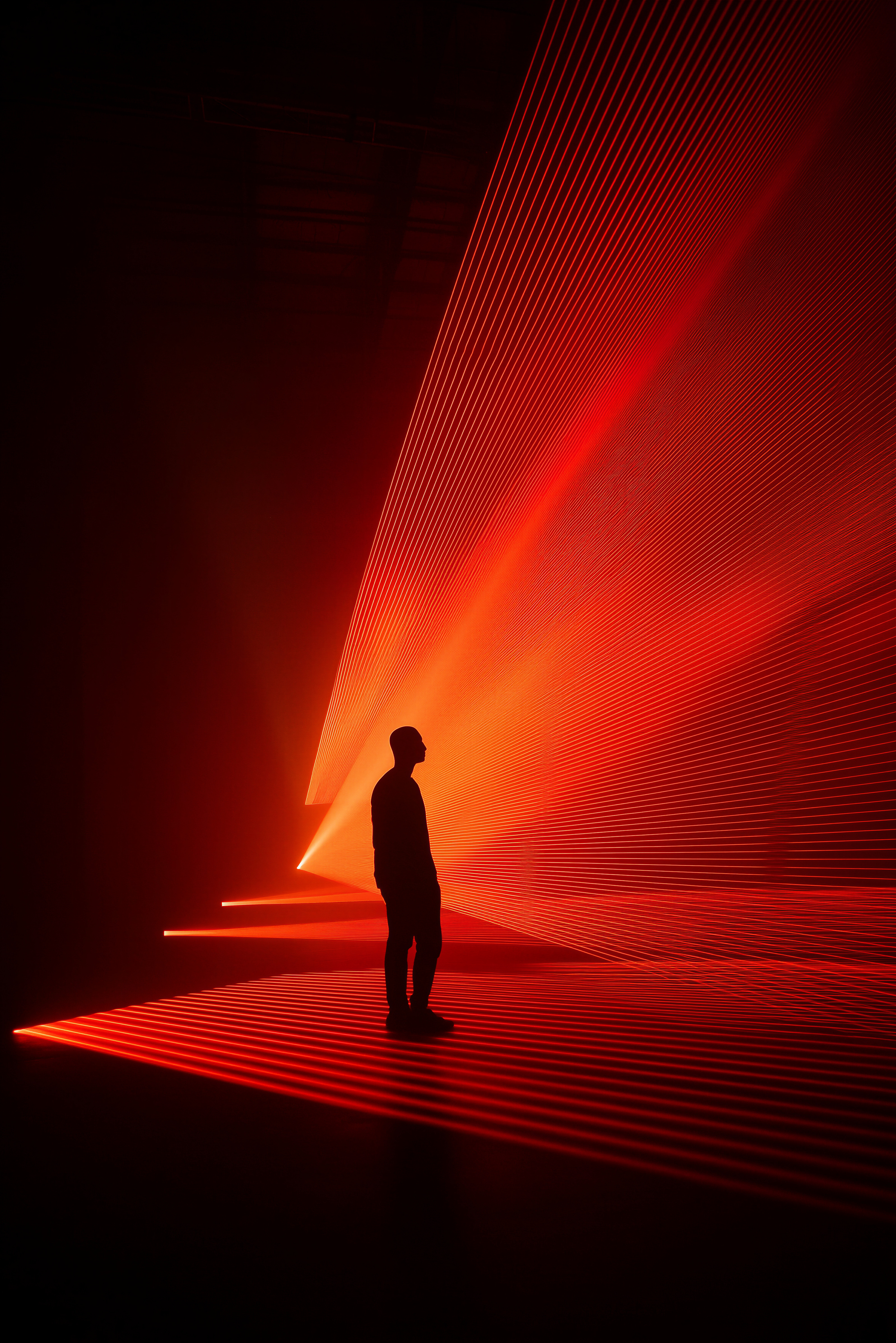 A sculptural scene in warm orange light